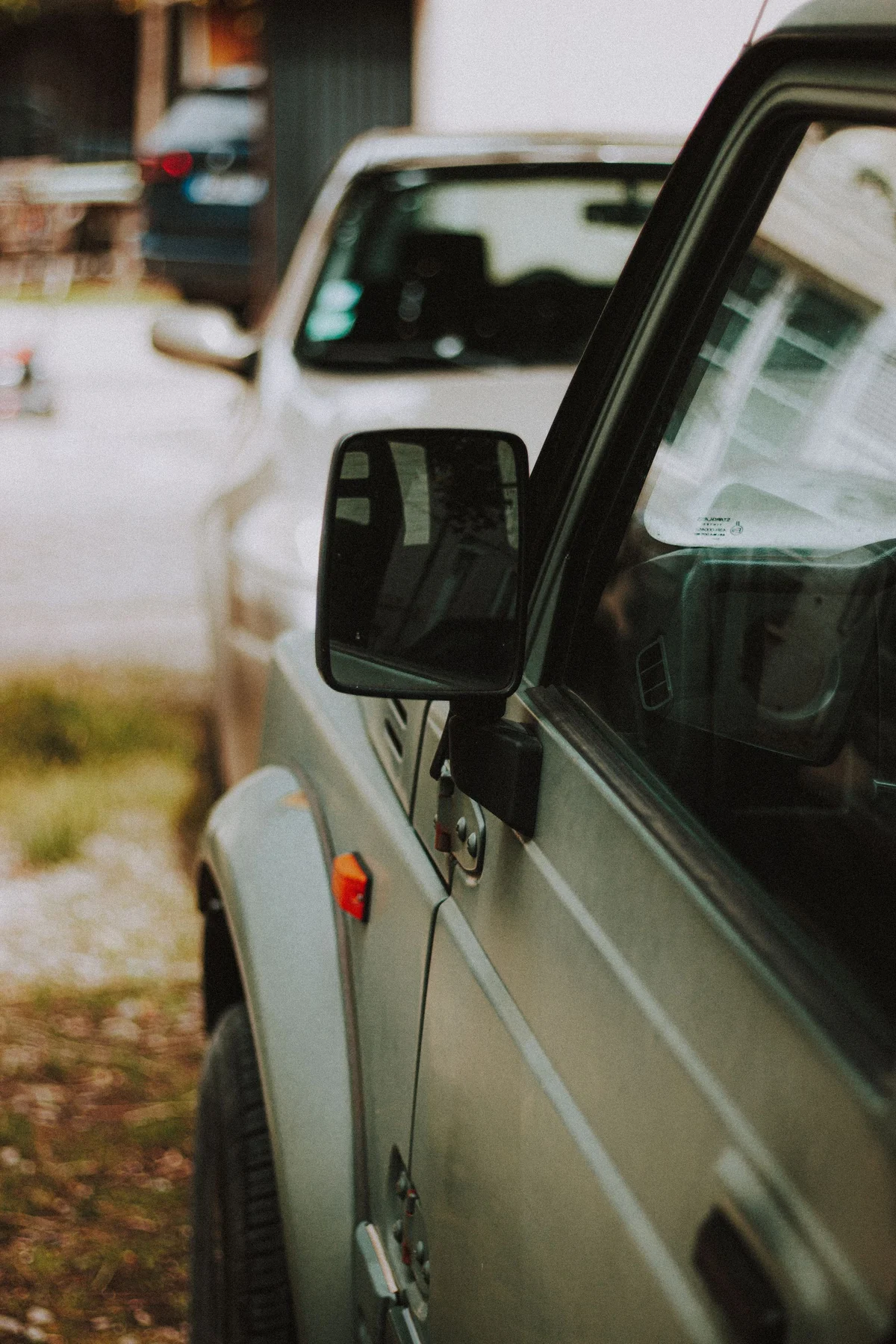 Door and side mirror of a parked car